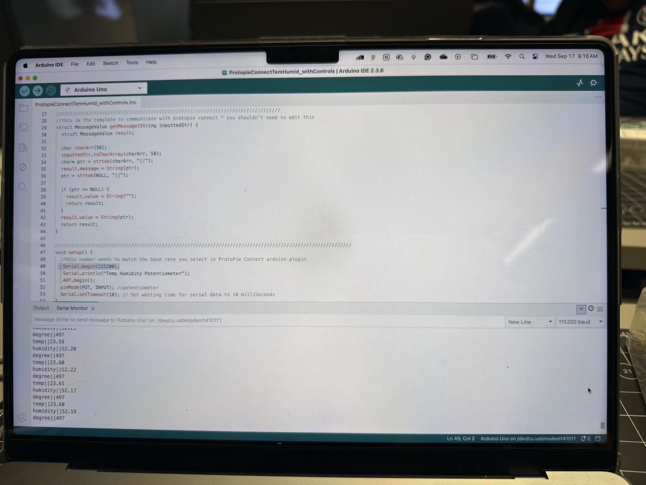 Arduino IDE open on the screen, code ready to upload